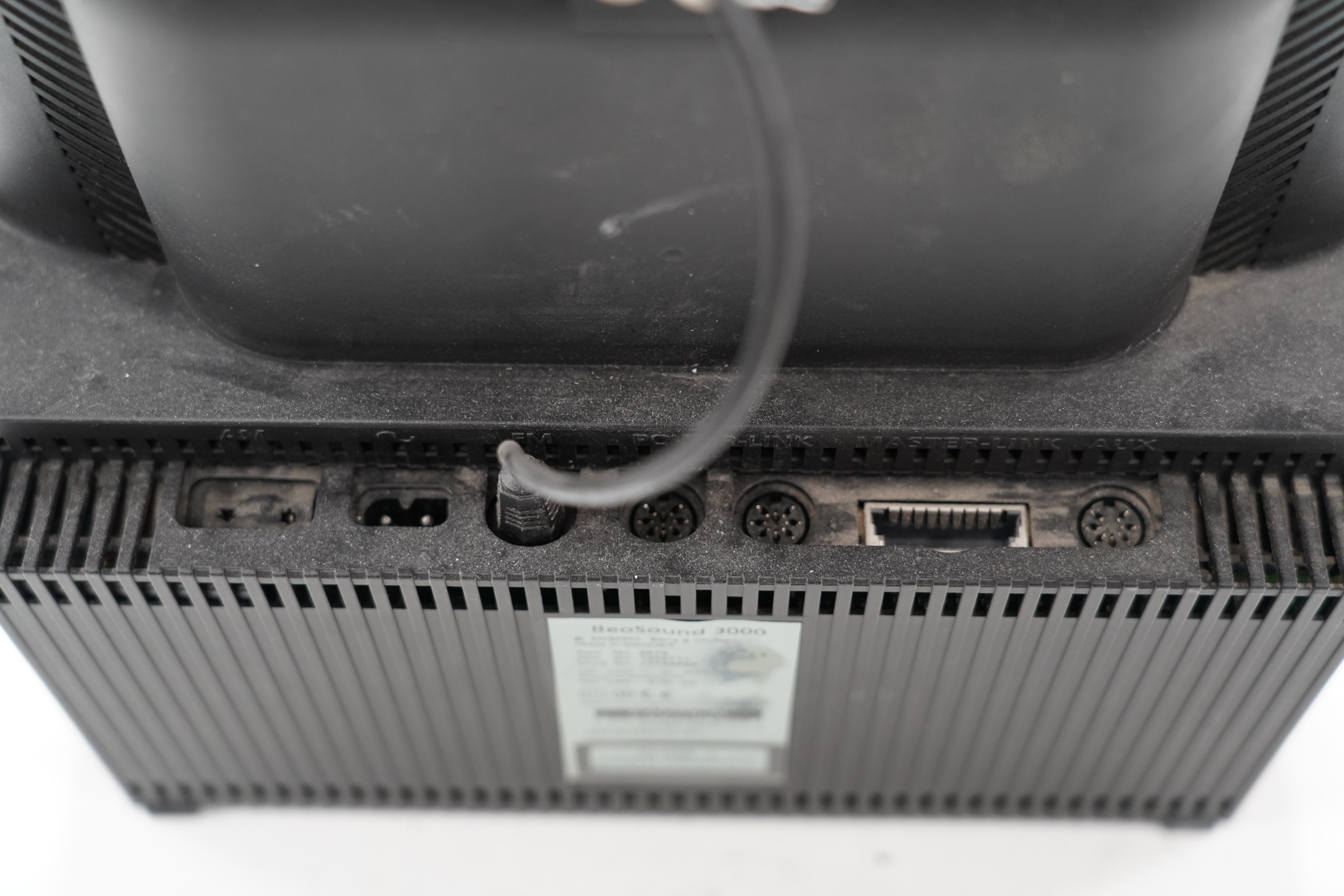 A Bang & Olufsen BeoSound 3000 CD player and music system, 37cm high, with instruction booklet, cables and remote control